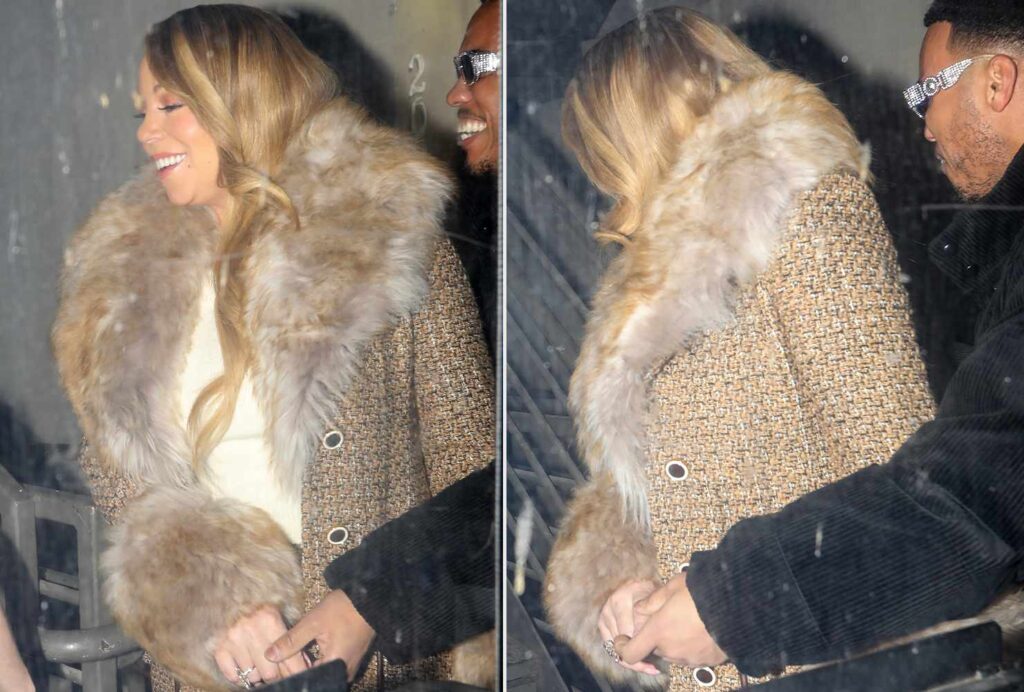 Mariah Carey Anderson. Paak holding hands